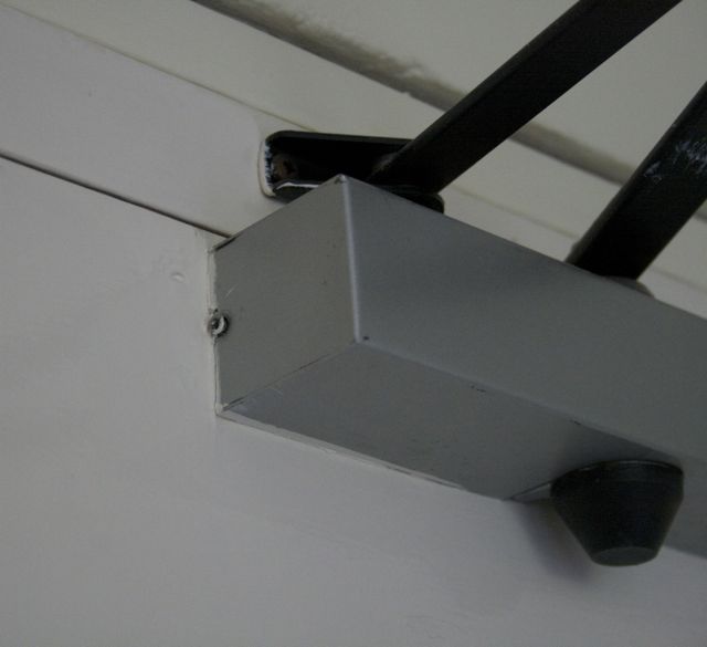 Screw attaching cover to Briton 2003 door closer